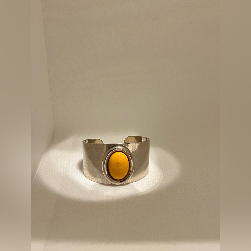 Silver cuff bracelet with yellow stone
